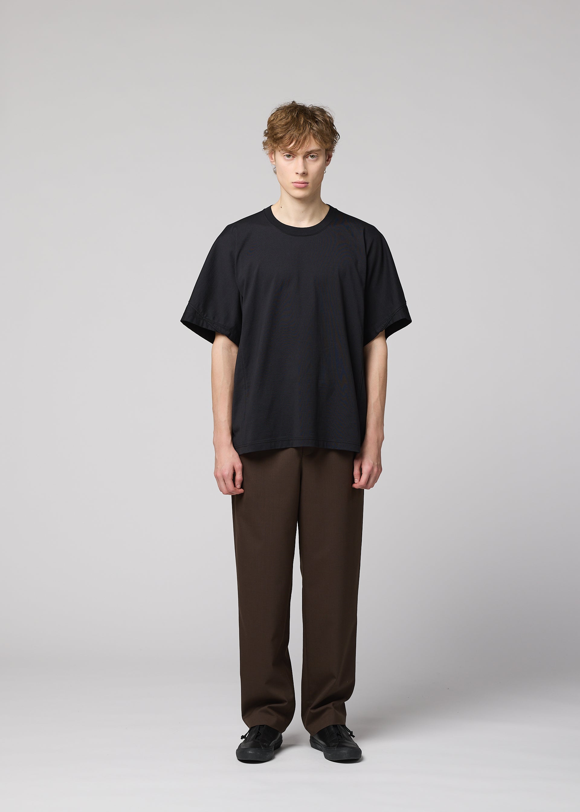 A model wears the IM MEN TURN turn-t-shirt-white.