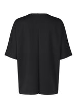 A detail shot of the IM MEN FLAT T t shirt.