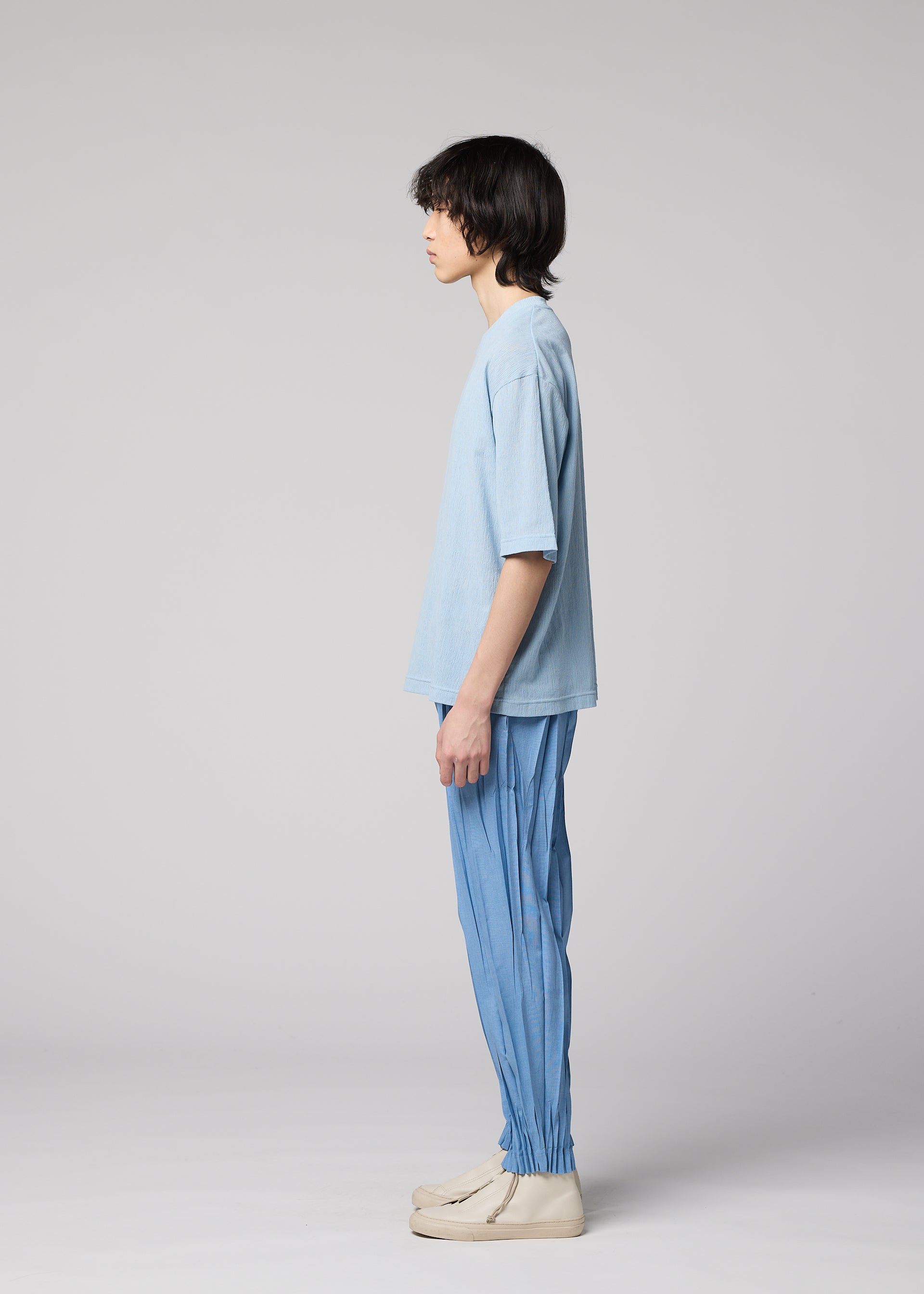 A model wears the IM MEN CREPE TUCK JERSEY crepe-tuck-jersey-t-shirt-light-beige.