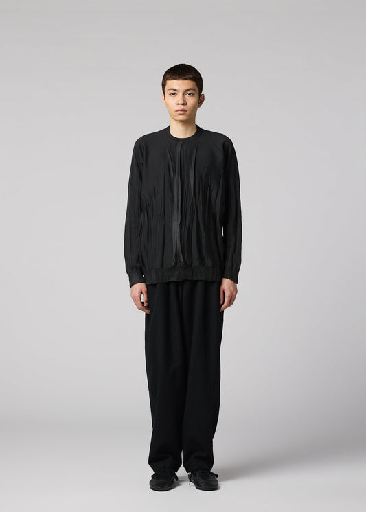 A model wears the IM MEN RIPPLE KNIT ripple-knit-knit-pink.