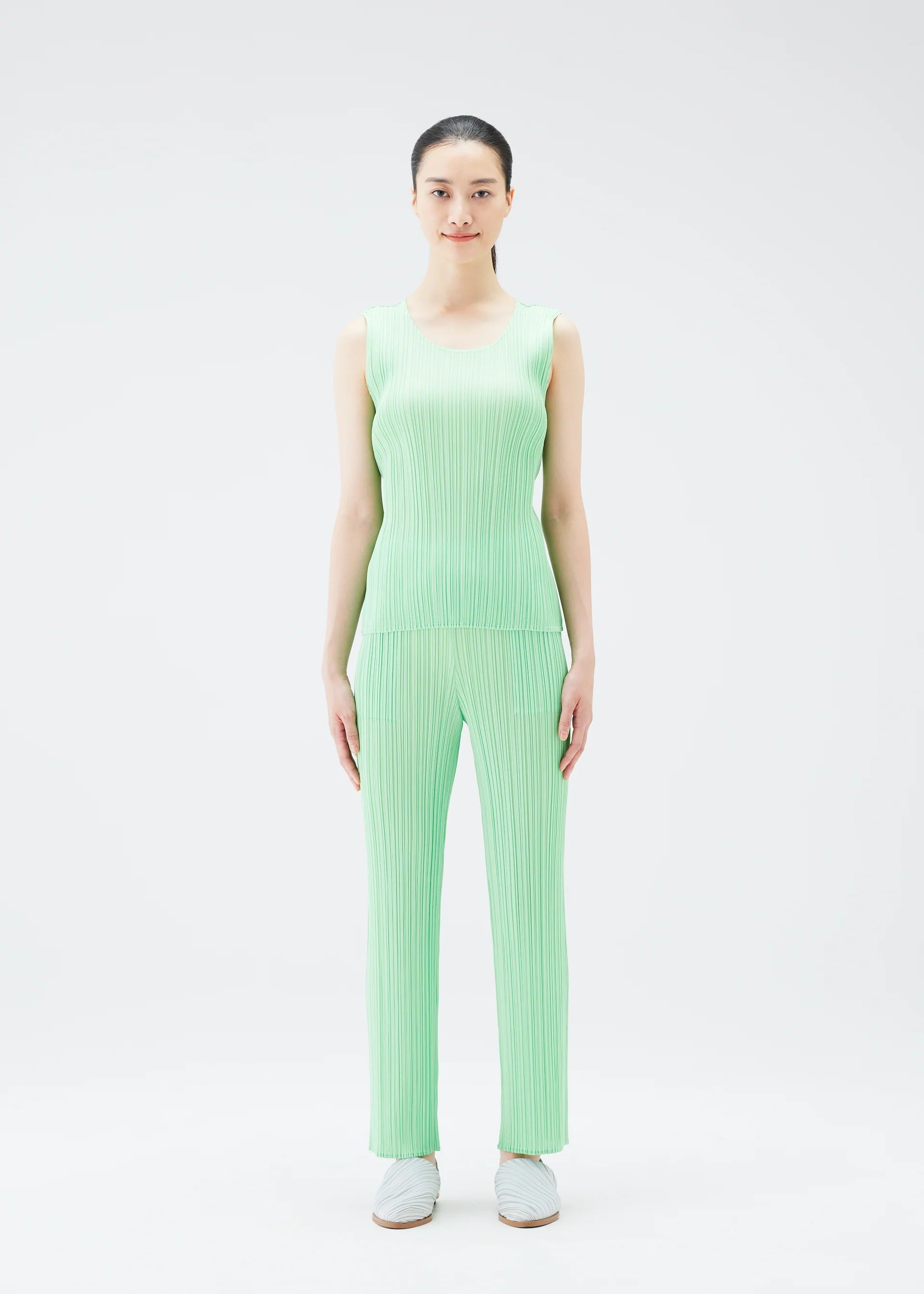A model wears the PLEATS PLEASE ISSEY MIYAKE NEW COLORFUL BASICS 4 pp67jk4014405.