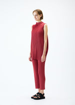 A model wears the PLEATS PLEASE ISSEY MIYAKE LAMP SHADE trousers.