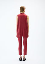 A model wears the PLEATS PLEASE ISSEY MIYAKE LAMP SHADE trousers.