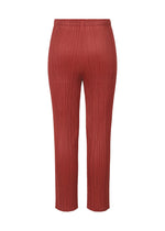 A detail shot of the PLEATS PLEASE ISSEY MIYAKE LAMP SHADE trousers.
