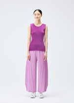 A model wears the Pleats Please Issey Miyake MIST SEPTEMBER top.