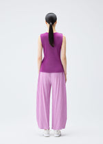 A model wears the Pleats Please Issey Miyake MIST SEPTEMBER top.
