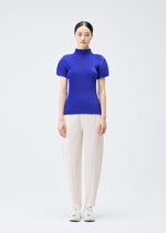 A model wears the Pleats Please Issey Miyake MIST SEPTEMBER top.