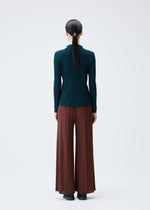 A model wears the Pleats Please Issey Miyake RIB PLEATS NOVEMBER shirt.