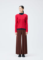 A model wears the Pleats Please Issey Miyake RIB PLEATS NOVEMBER cardigan.