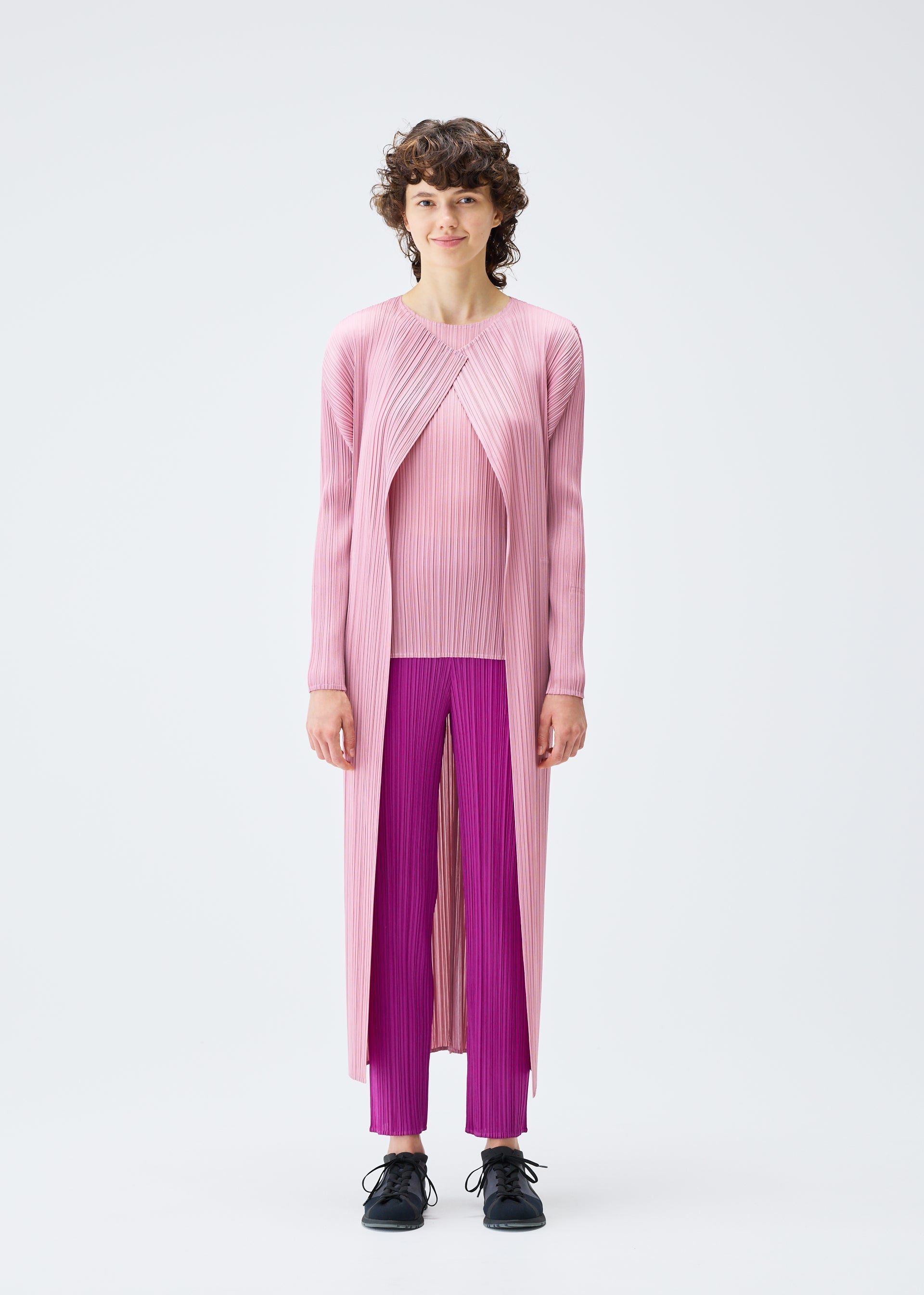 A model wears the Pleats Please Issey Miyake MONTHLY COLORS SEPTEMBER coat.