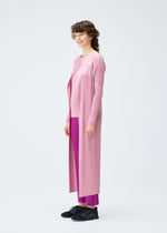 A model wears the Pleats Please Issey Miyake MONTHLY COLORS SEPTEMBER coat.
