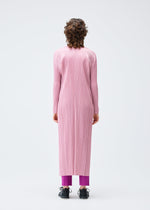 A model wears the Pleats Please Issey Miyake MONTHLY COLORS SEPTEMBER coat.