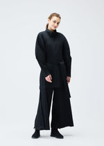 A model wears the Pleats Please Issey Miyake WOOL PLEATS coat.
