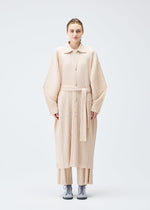 A model wears the Pleats Please Issey Miyake WOOL PLEATS coat.