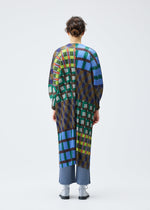 A model wears the Pleats Please Issey Miyake HARMONY coat.