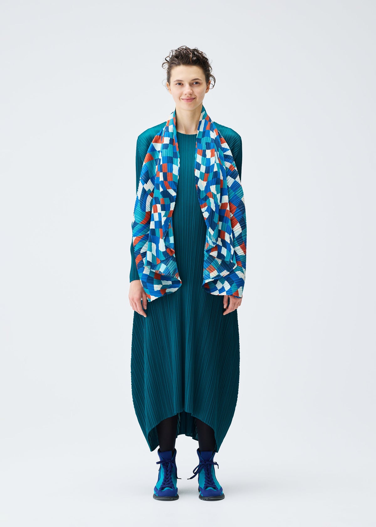 A model wears the PLEATS PLEASE ISSEY MIYAKE DANCING SQUARE vest.