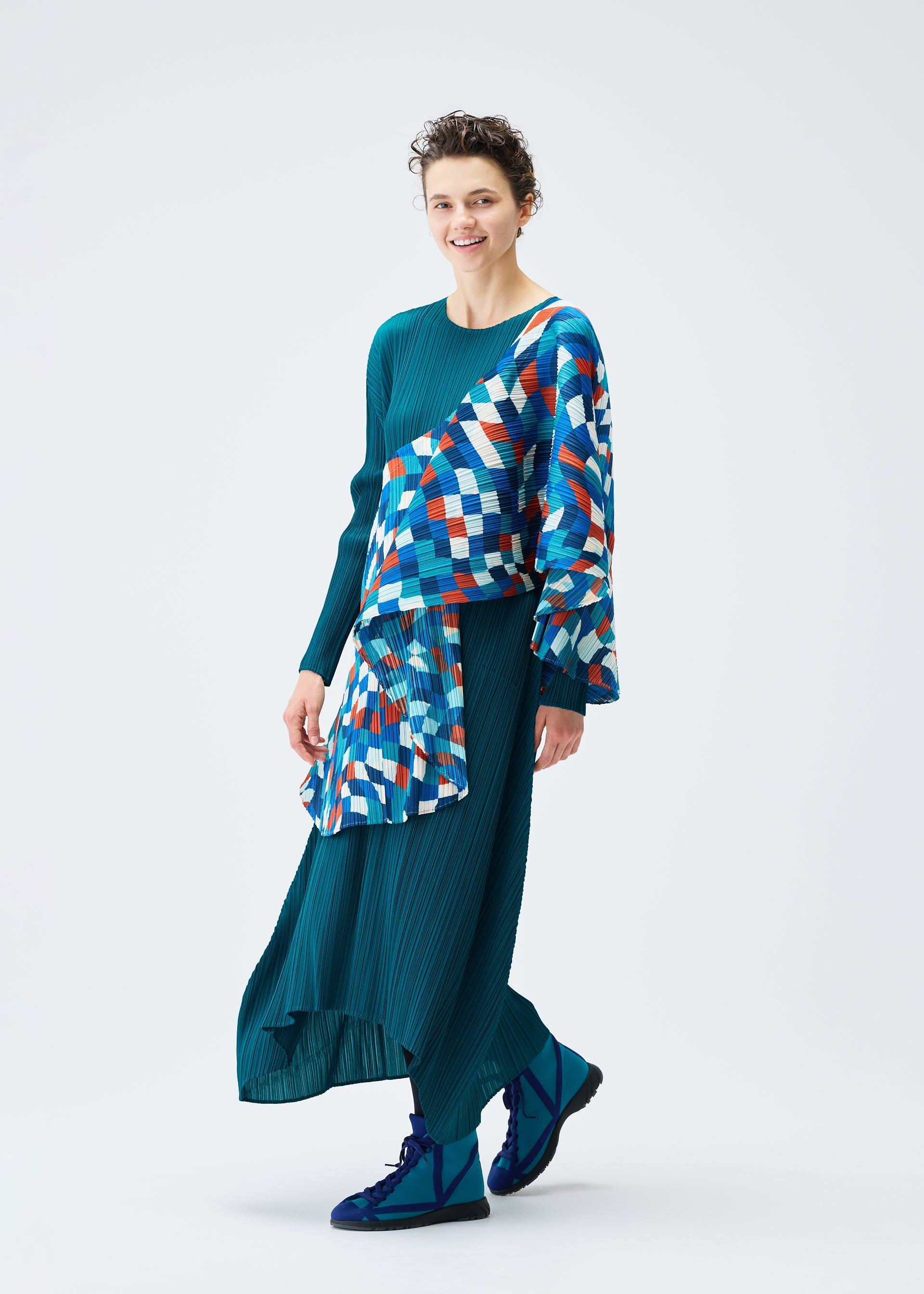 A model wears the PLEATS PLEASE ISSEY MIYAKE DANCING SQUARE vest.