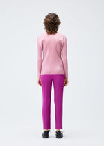 A model wears the Pleats Please Issey Miyake MONTHLY COLORS SEPTEMBER trousers.