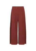 A detail shot of the Pleats Please Issey Miyake WOOL PLEATS trousers.