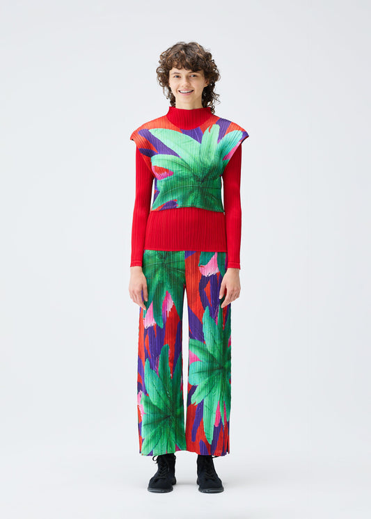 A model wears the Pleats Please Issey Miyake CARNIVAL trousers.