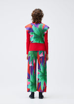 A model wears the Pleats Please Issey Miyake CARNIVAL trousers.