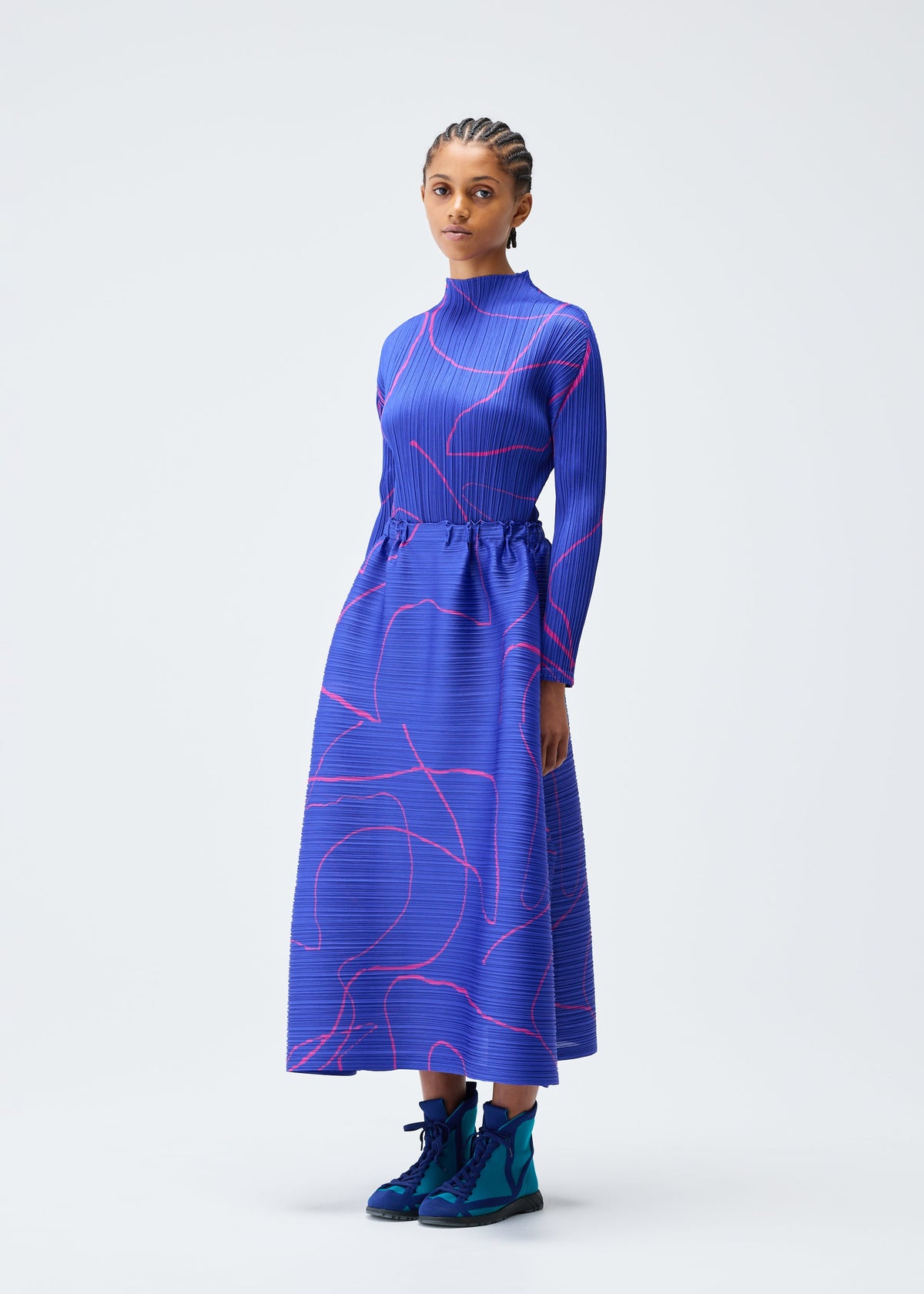 A model wears the Pleats Please Issey Miyake PAUSE skirt.