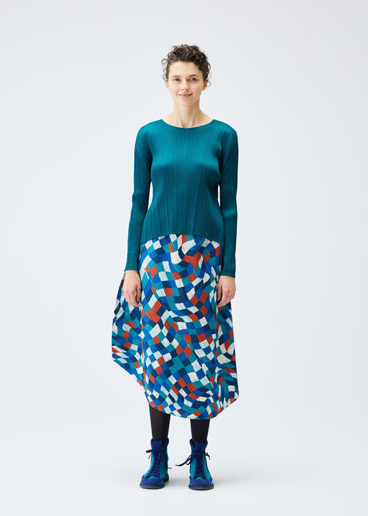 A model wears the PLEATS PLEASE ISSEY MIYAKE DANCING SQUARE skirt.