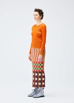 A model wears the Pleats Please Issey Miyake HARMONY skirt.