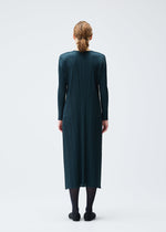 A model wears the Pleats Please Issey Miyake MONTHLY COLORS : NOVEMBER dress.