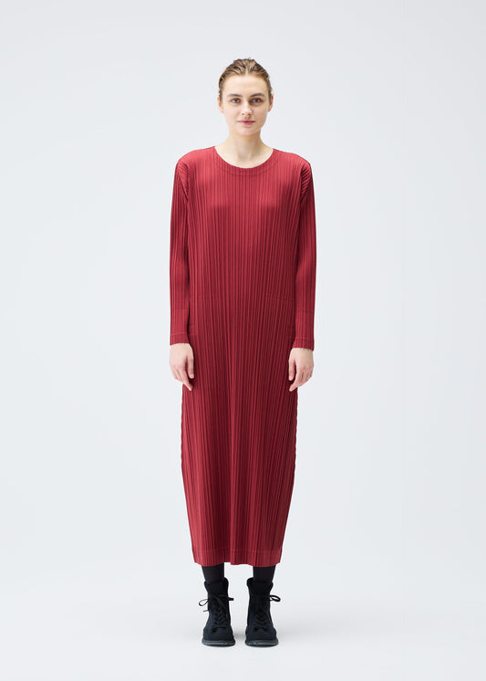 A model wears the Pleats Please Issey Miyake WOOL PLEATS dress.