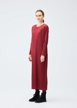 A model wears the Pleats Please Issey Miyake WOOL PLEATS dress.