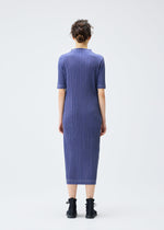 A model wears the PLEATS PLEASE ISSEY MIYAKE COTTON DENIM dress.