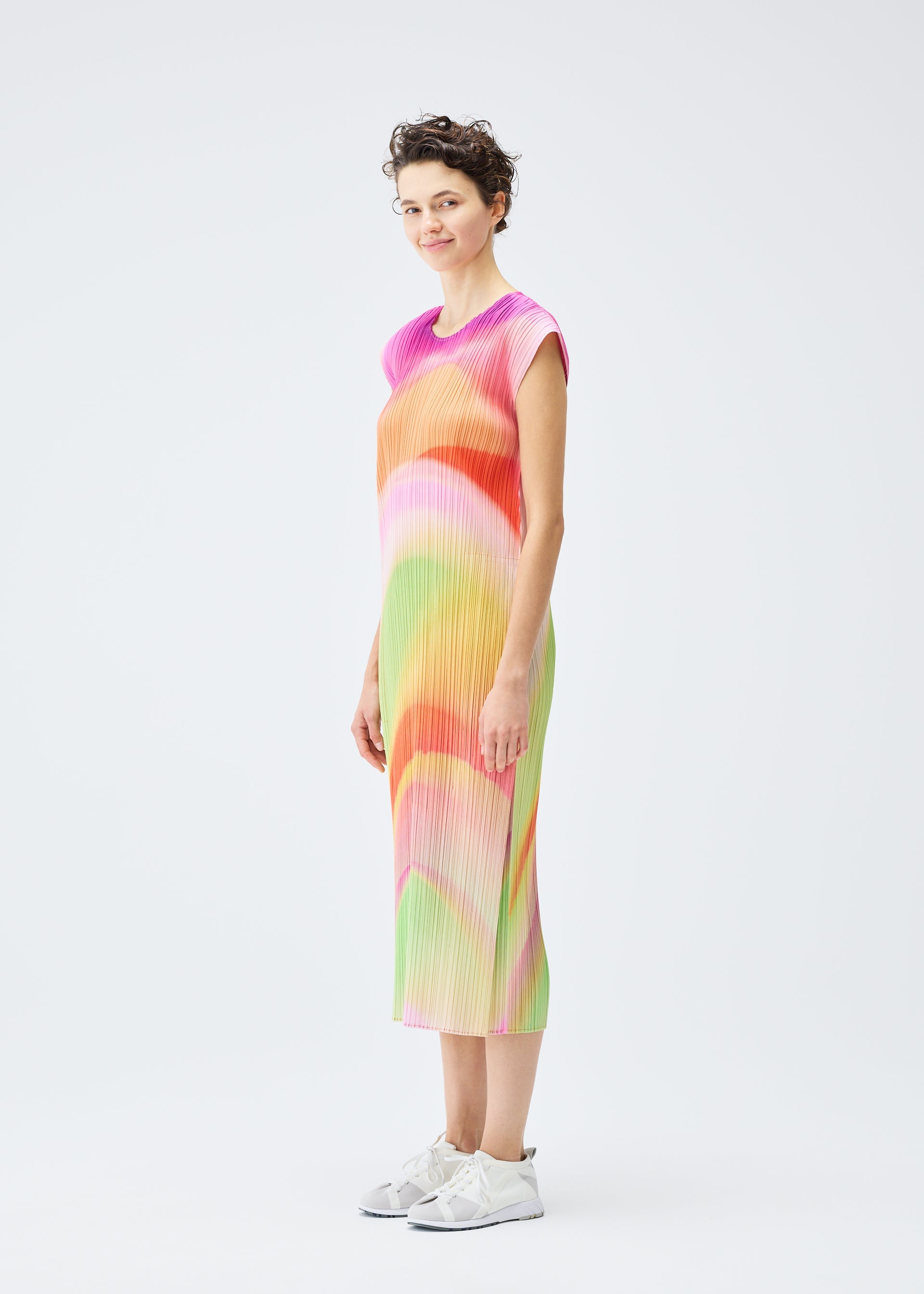 A model wears the PLEATS PLEASE ISSEY MIYAKE GROOVE dress.
