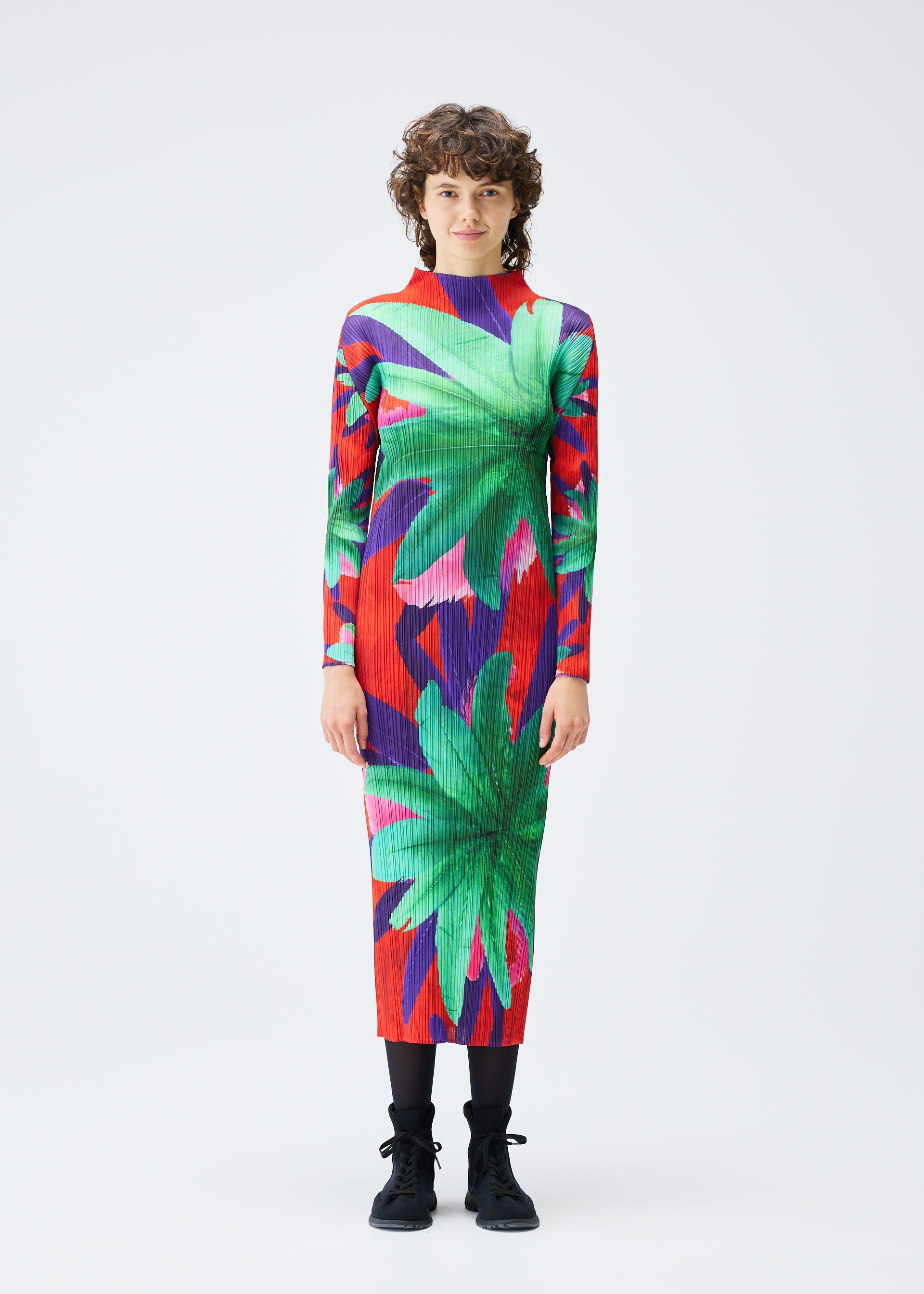 A model wears the Pleats Please Issey Miyake CARNIVAL dress.