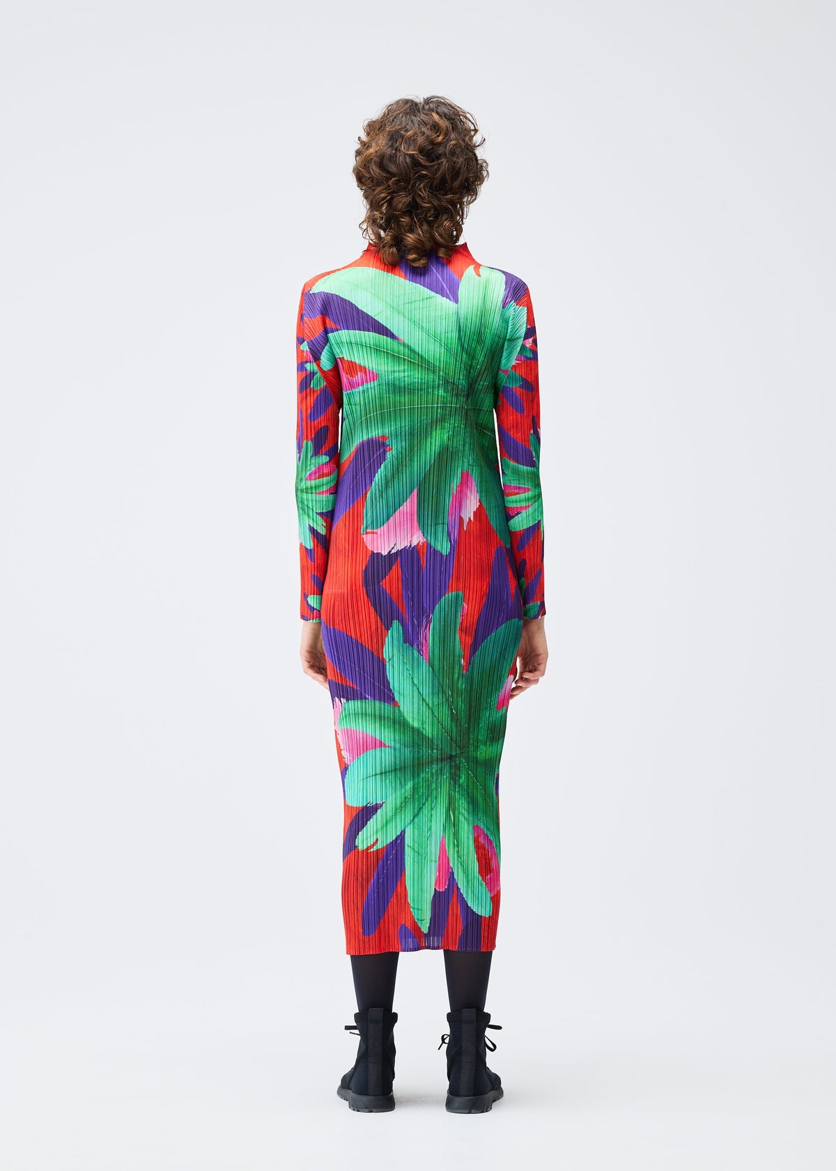 A model wears the Pleats Please Issey Miyake CARNIVAL dress.