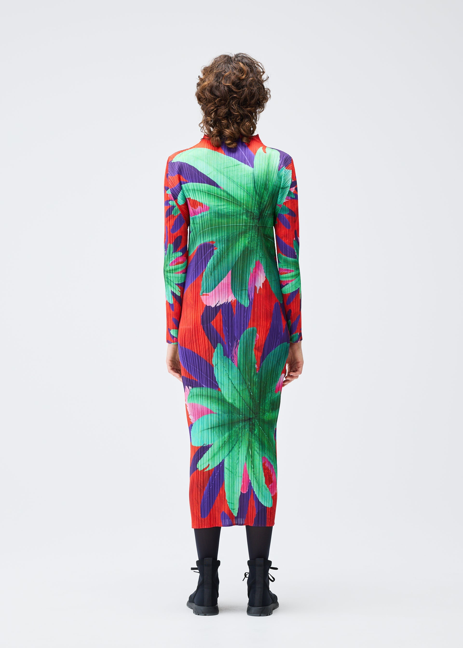 A model wears the Pleats Please Issey Miyake CARNIVAL dress.