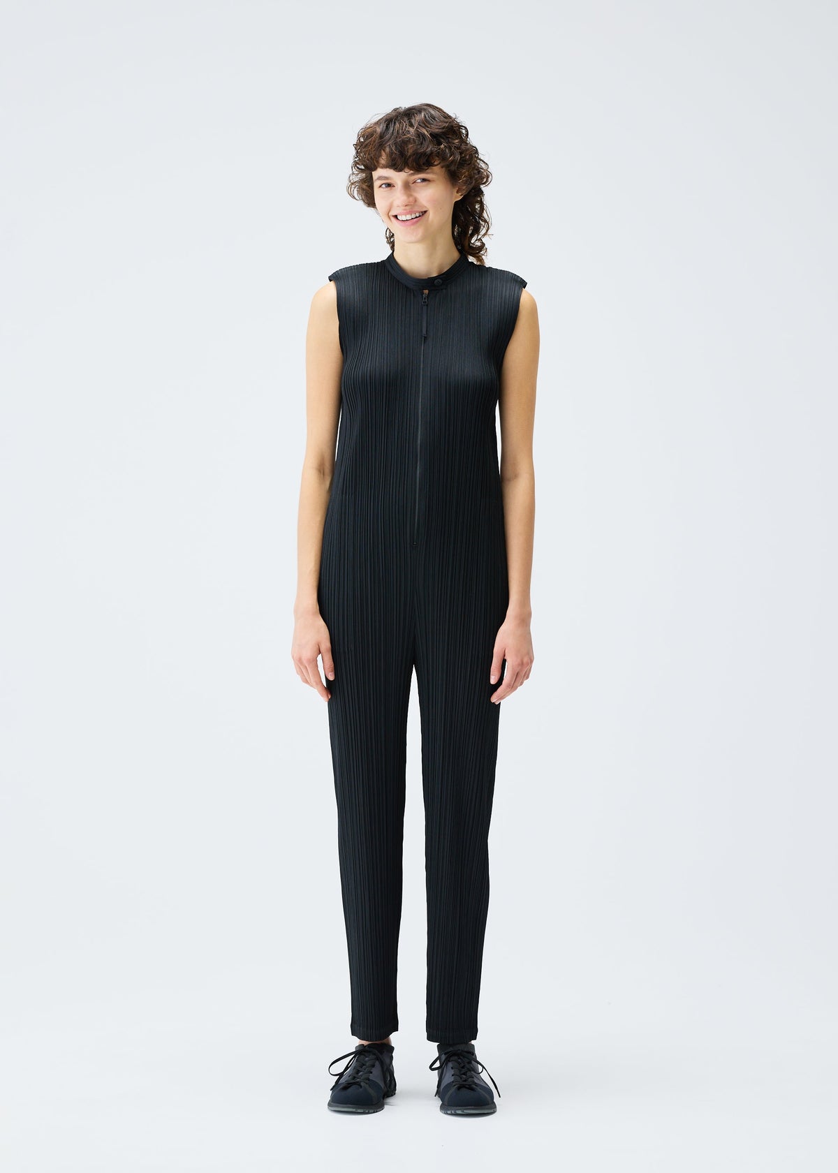 A model wears the Pleats Please Issey Miyake MONTHLY COLORS SEPTEMBER jumpsuit.