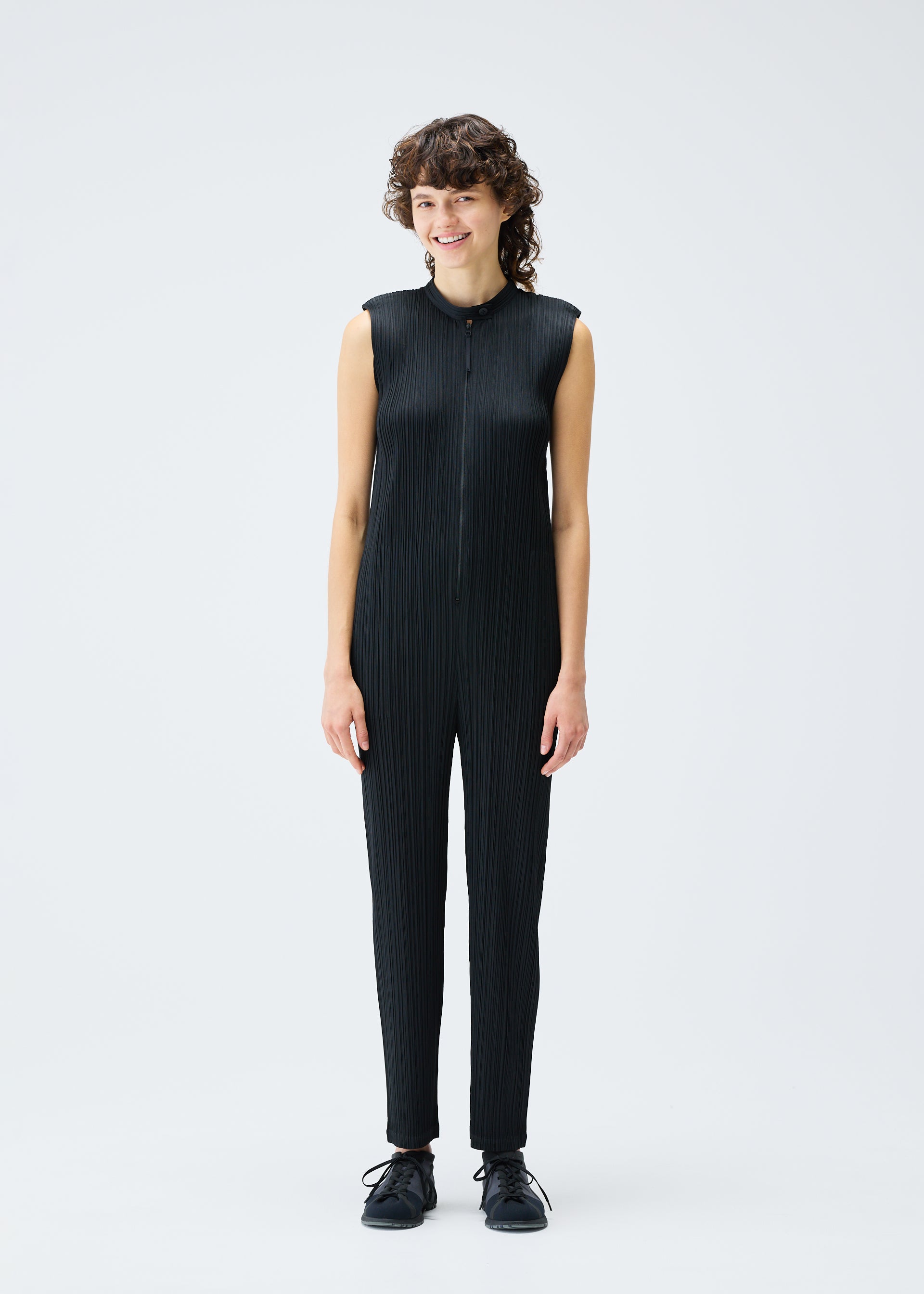 A model wears the Pleats Please Issey Miyake MONTHLY COLORS SEPTEMBER jumpsuit.