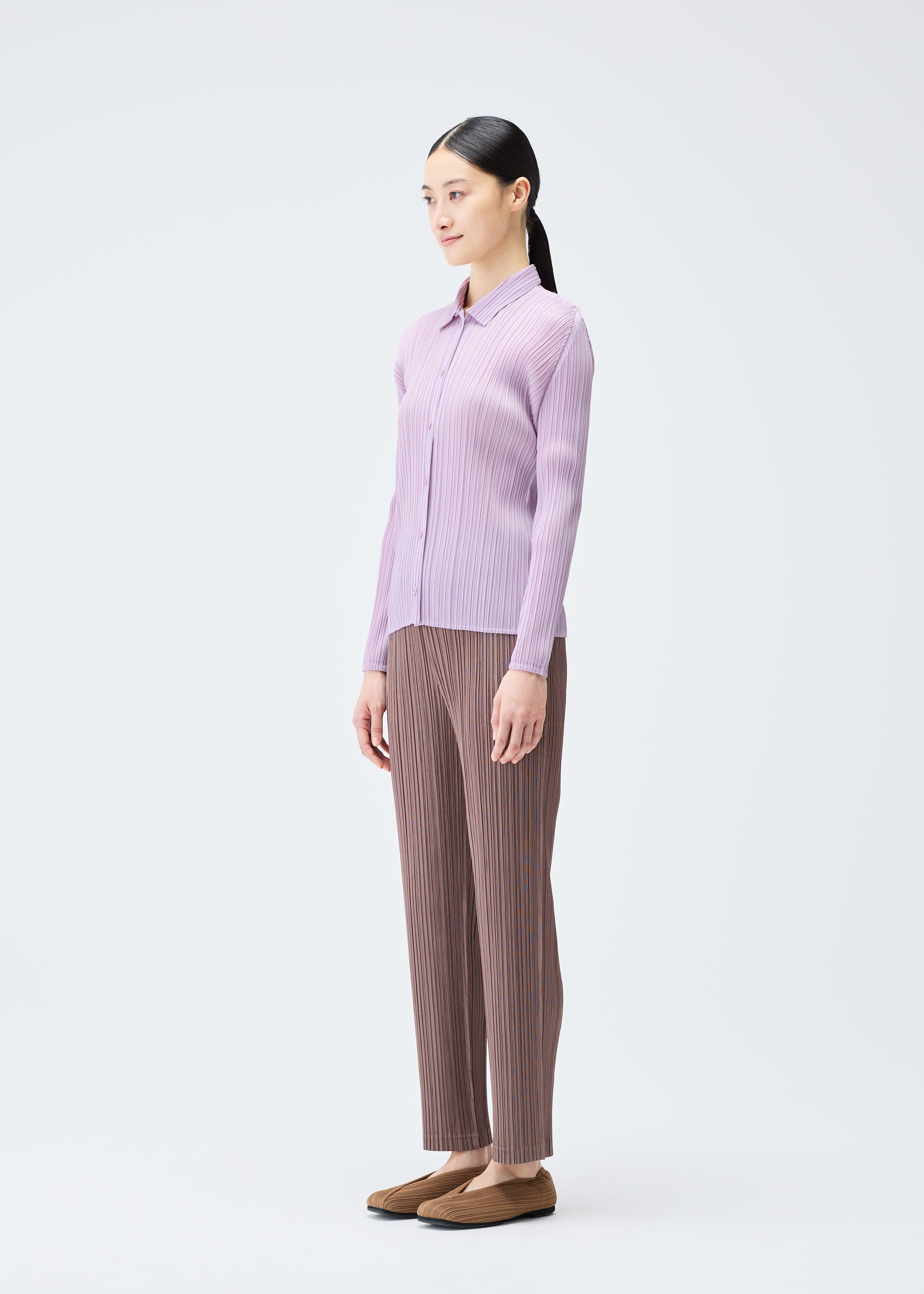 A model wears the Pleats Please Issey Miyake PLEATS Top top.