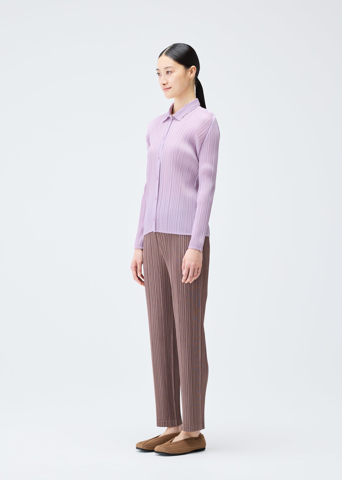A model wears the Pleats Please Issey Miyake PLEATS Top top.