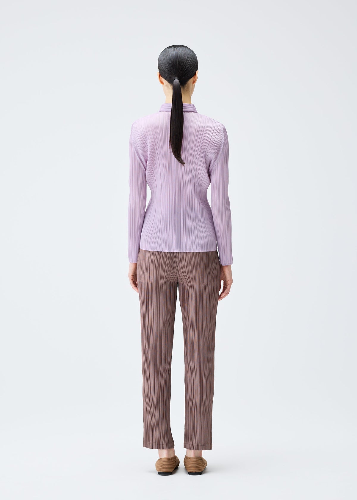 A model wears the Pleats Please Issey Miyake PLEATS Top top.