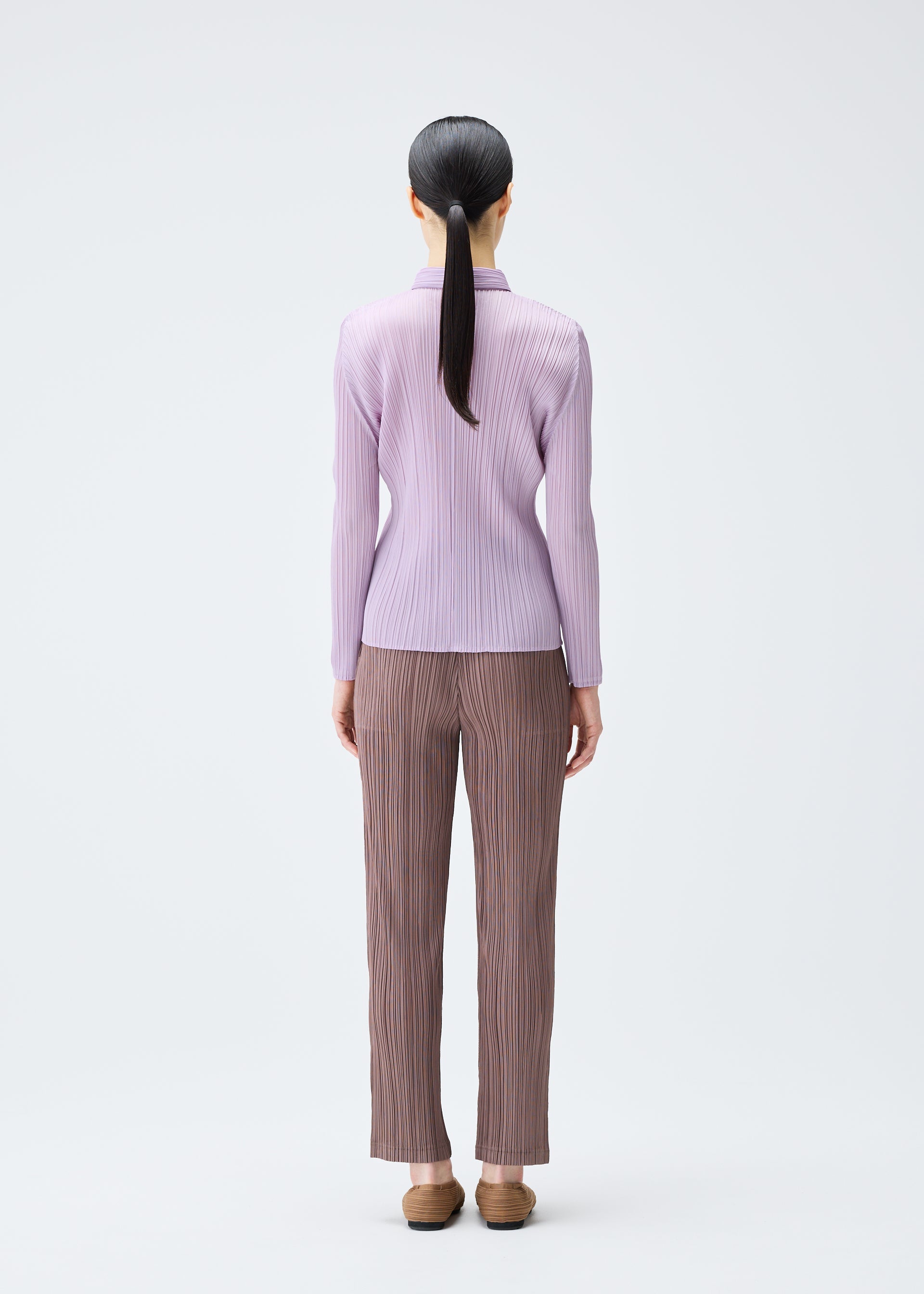 A model wears the Pleats Please Issey Miyake PLEATS Top top.
