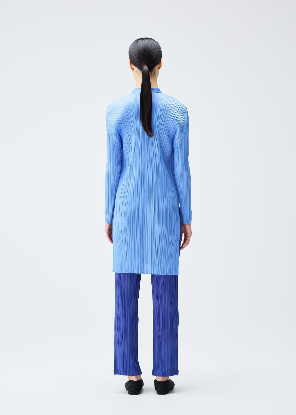 A model wears the Pleats Please Issey Miyake PLEATS Top top.