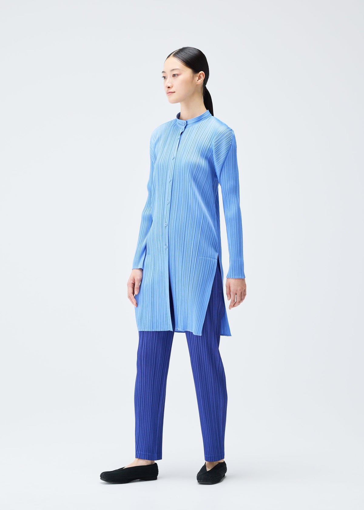 A model wears the Pleats Please Issey Miyake PLEATS Top top.
