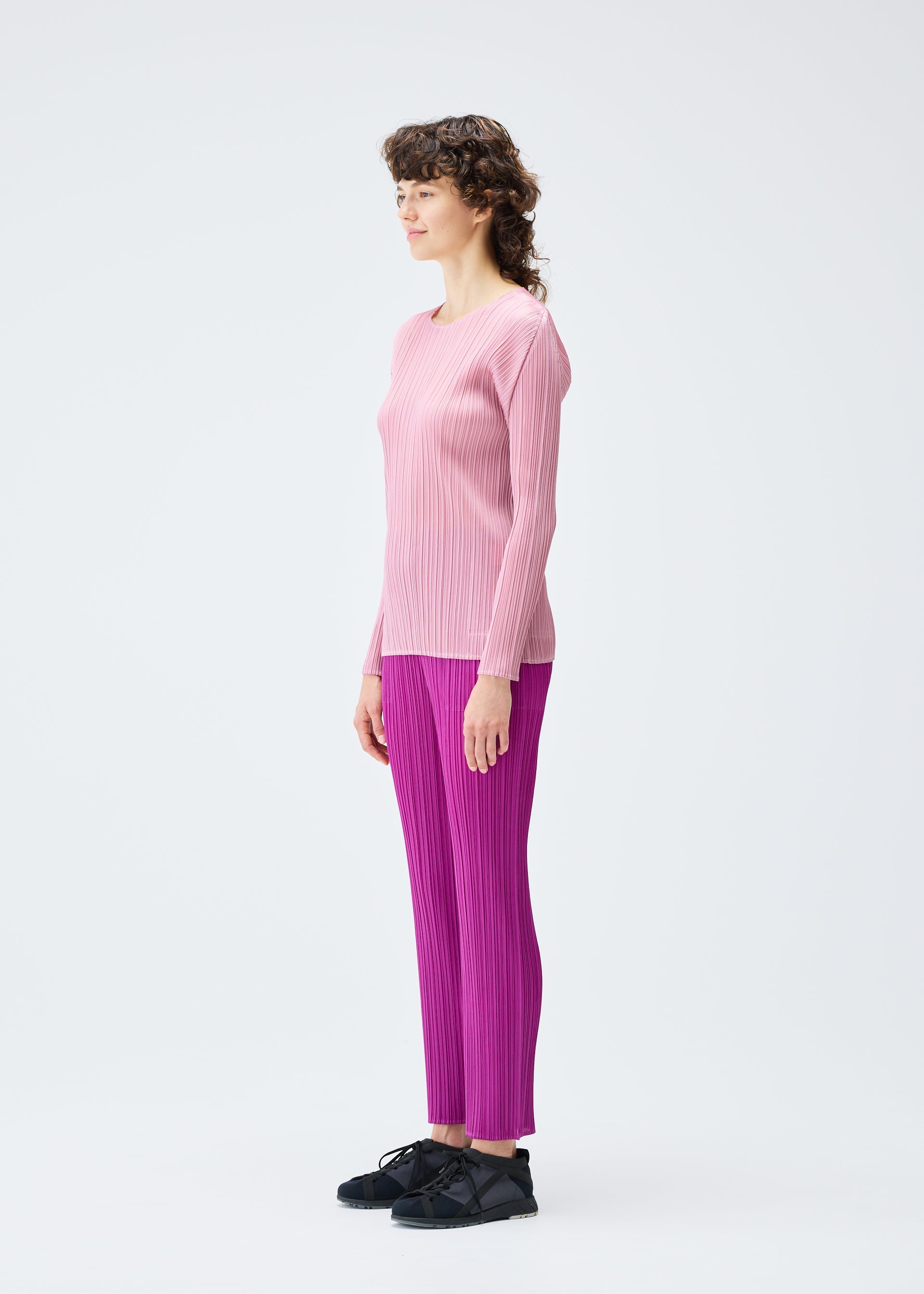 A model wears the Pleats Please Issey Miyake MONTHLY COLORS SEPTEMBER top.