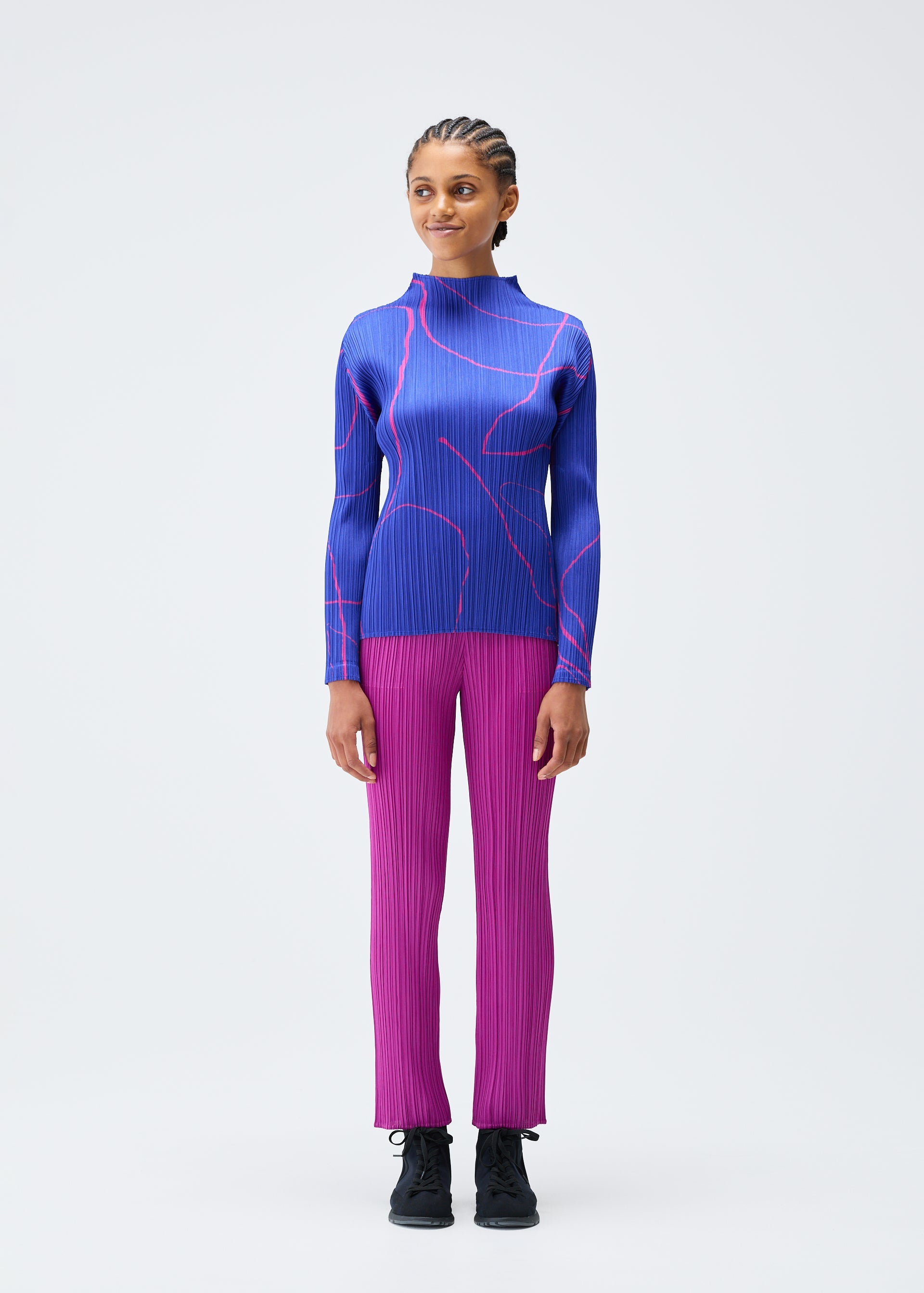 A model wears the Pleats Please Issey Miyake PAUSE top.