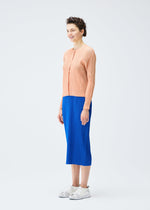 A model wears the PLEATS PLEASE ISSEY MIYAKE MONTHLY COLORS AUGUST cardigan.