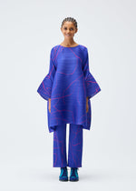A model wears the Pleats Please Issey Miyake PAUSE tunic.