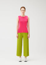 A model wears the PLEATS PLEASE ISSEY MIYAKE MIST JUNE mist-june-shirt-yellow-green.