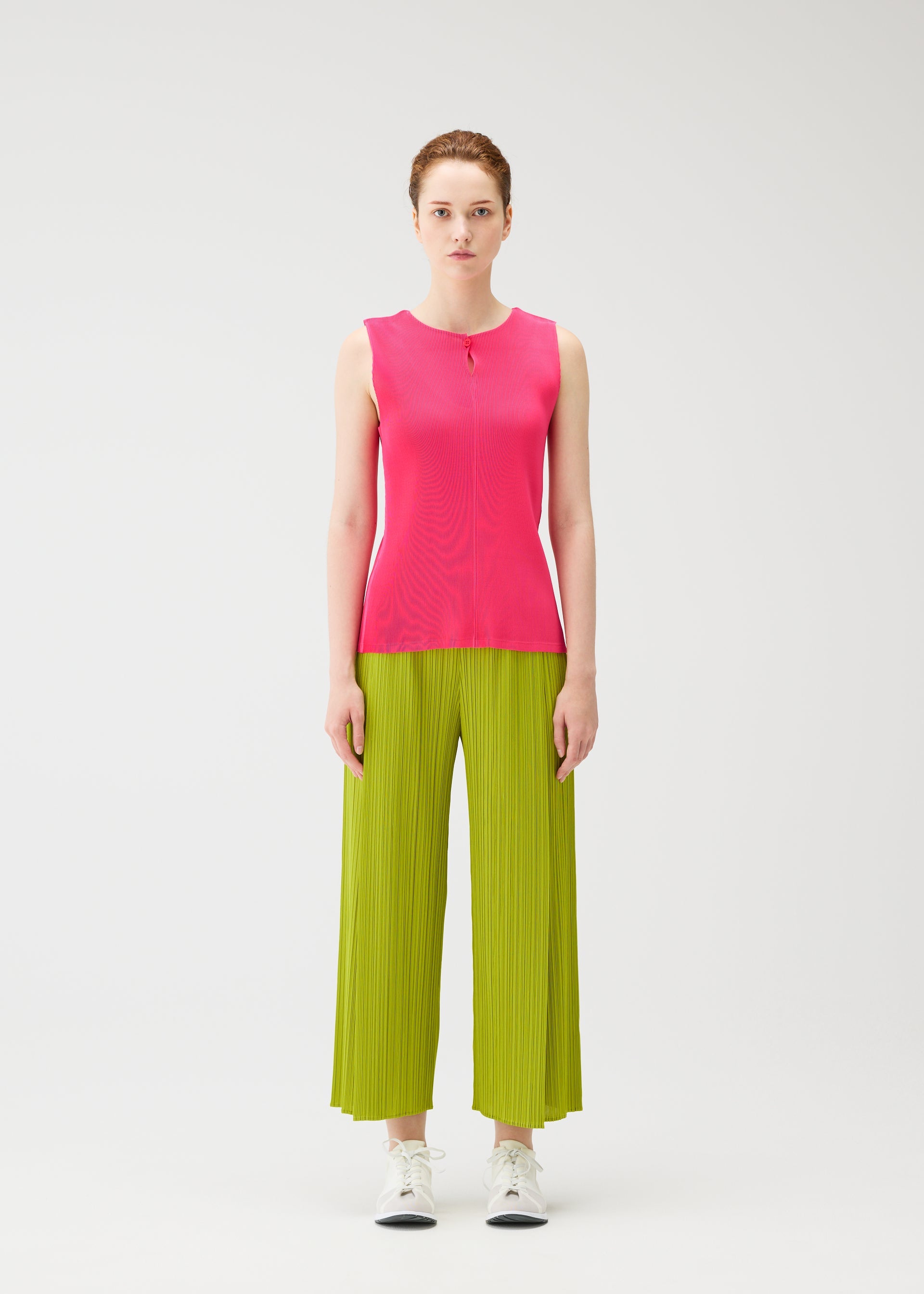 A model wears the PLEATS PLEASE ISSEY MIYAKE MIST JUNE mist-june-shirt-yellow-green.